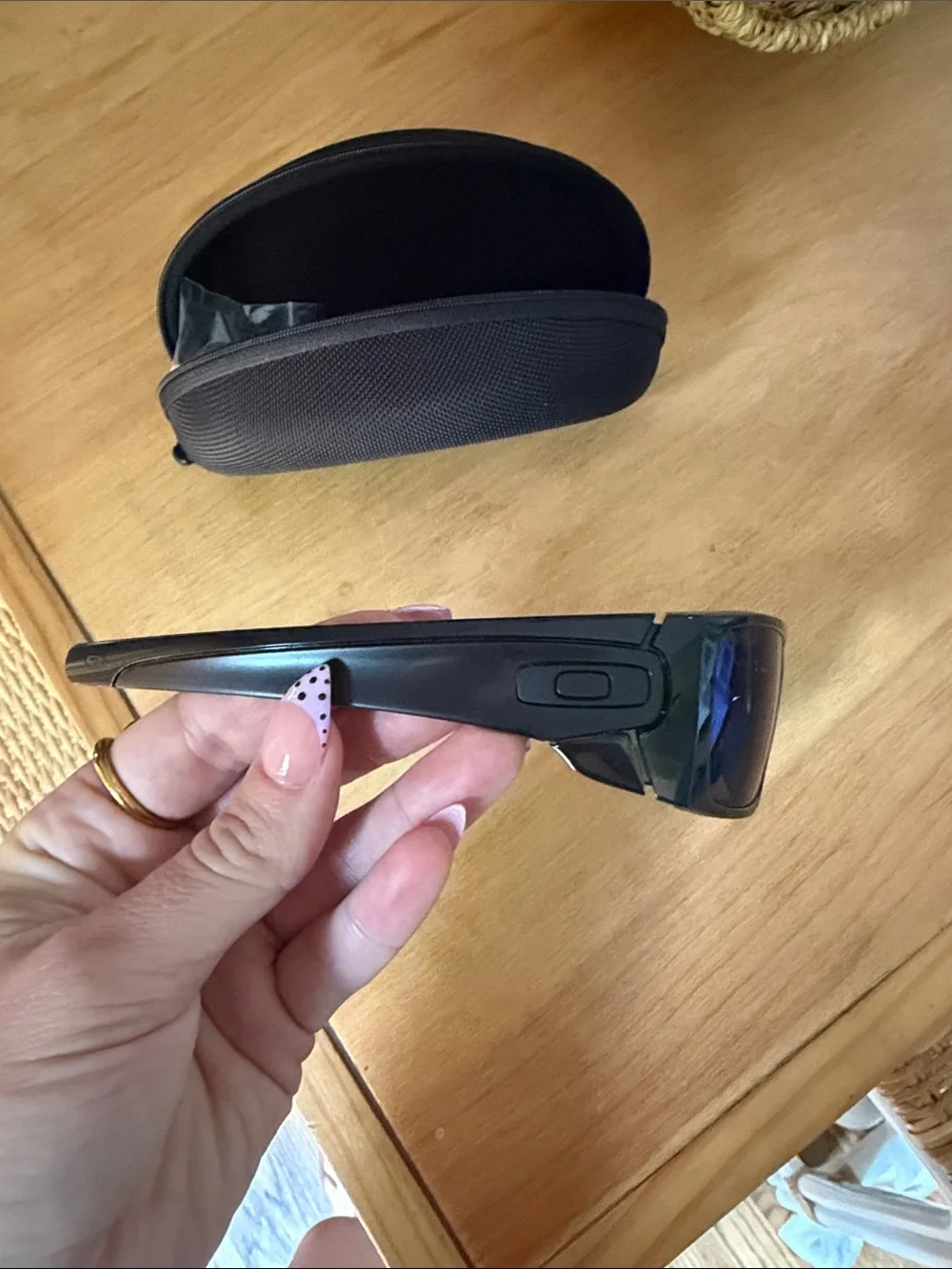 Oakley Black Frame Sunglasses with Blue Mirrored Lenses